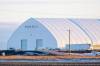 MIKE DEAL / FREE PRESS FILES
                                The sun rises over the search facility building at Prairie Green Landfill after human remains were found there in late February. Premier Wab Kinew said the search is under budget so far.